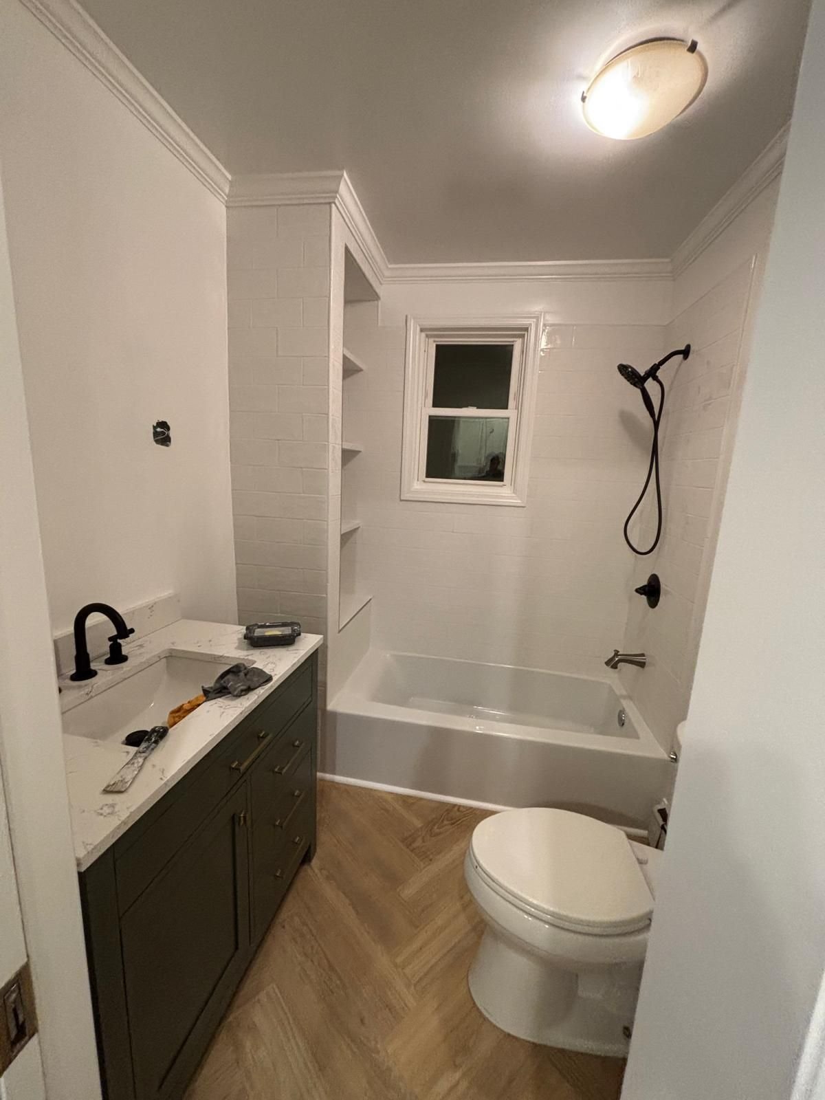 After: bathroom with smooth painted walls and crisp crown molding