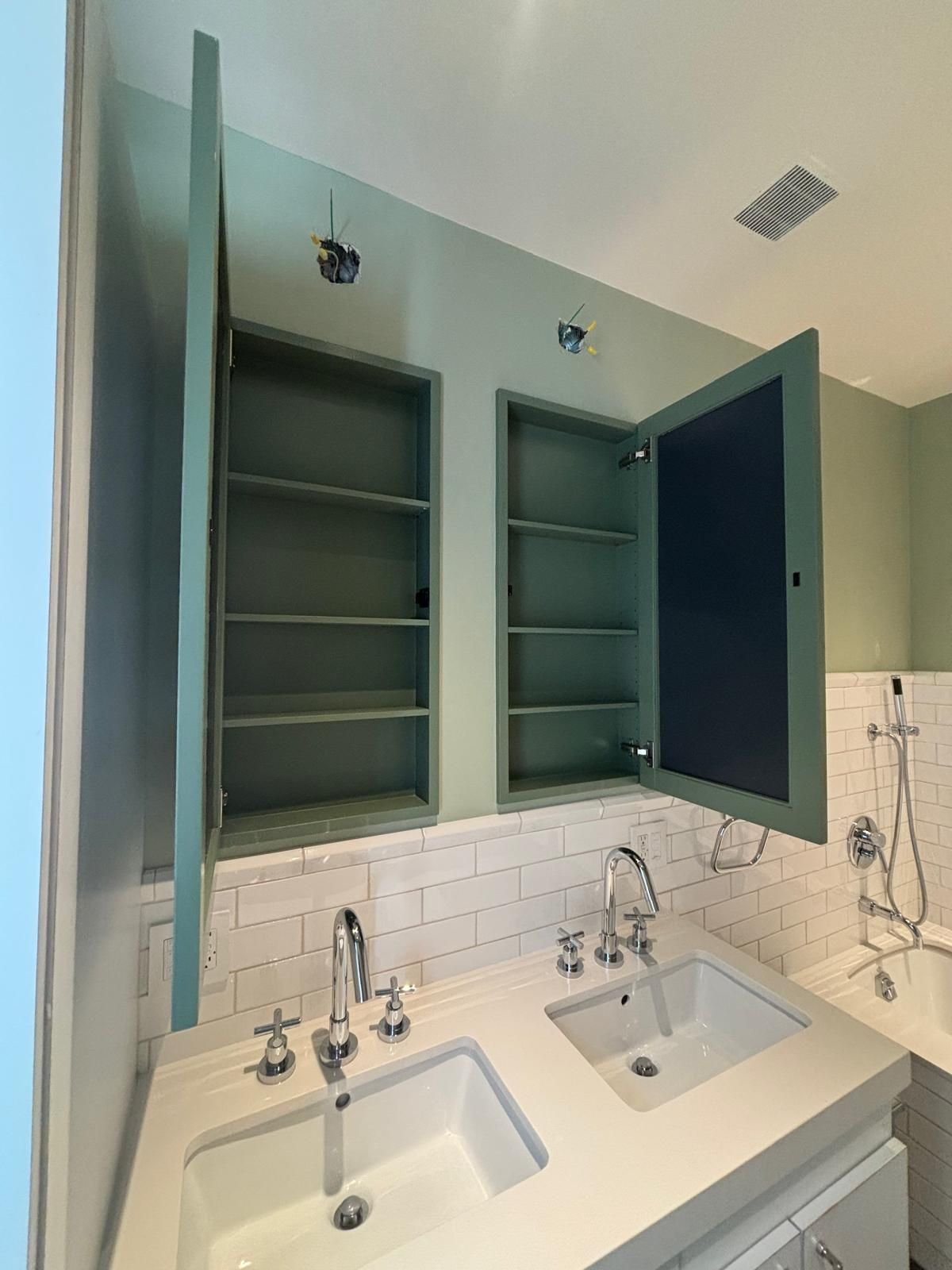 Built-in medicine cabinets painted to match the walls