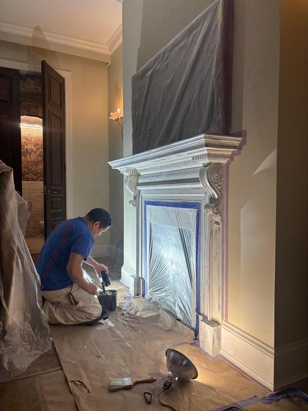 Detail work on an ornate fireplace mantel