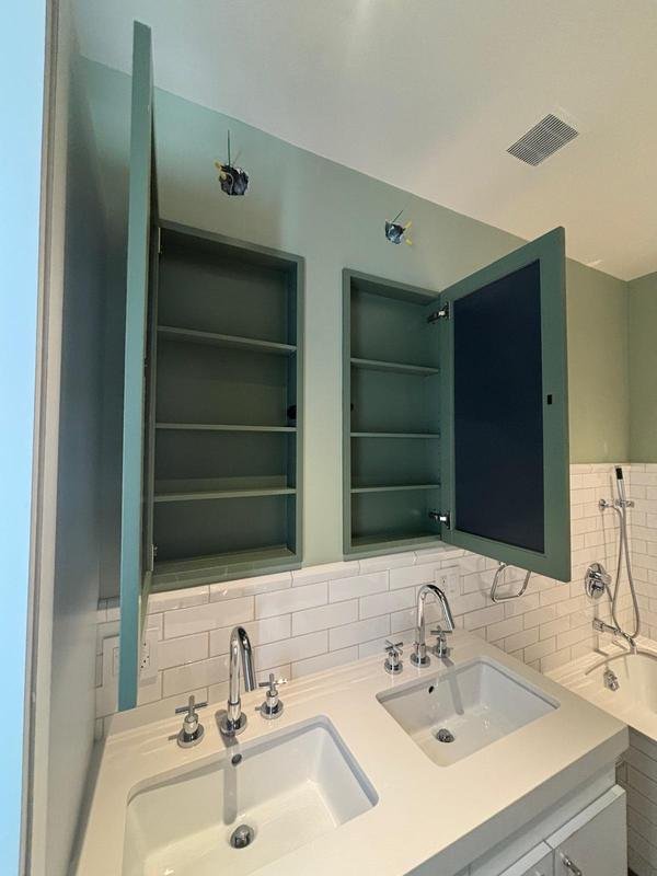 Built-in medicine cabinets painted to match the walls